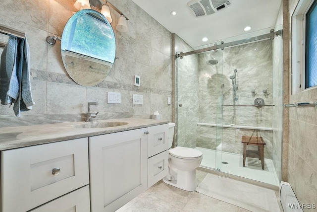 425 Vanderbilt Ave, Niagara Falls, NY 14305 - bathroom featuring tile walls, vanity, a shower stall, and tile patterned flooring