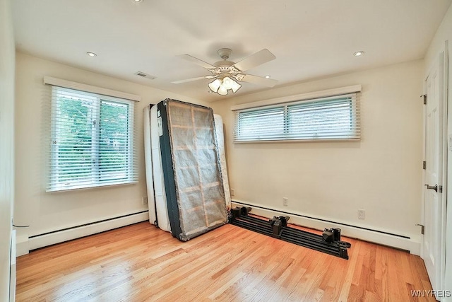 425 Vanderbilt Ave, Niagara Falls, NY 14305 - unfurnished room with a baseboard radiator, a baseboard heating unit, a ceiling fan, wood finished floors, and recessed lighting