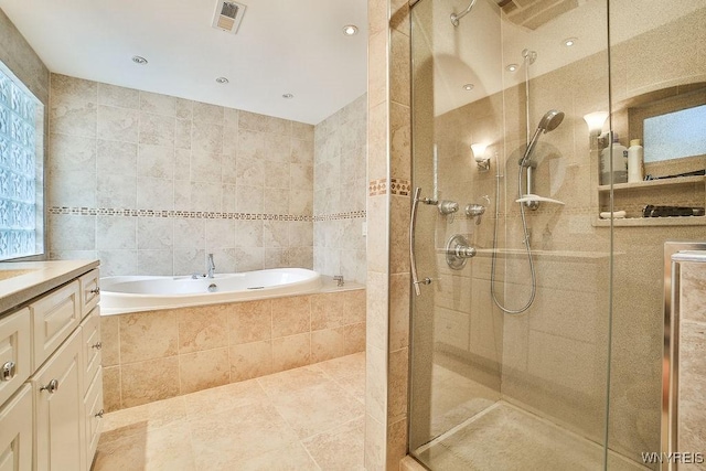 425 Vanderbilt Ave, Niagara Falls, NY 14305 - bathroom featuring a stall shower, a bath, tile walls, vanity, and tile patterned floors