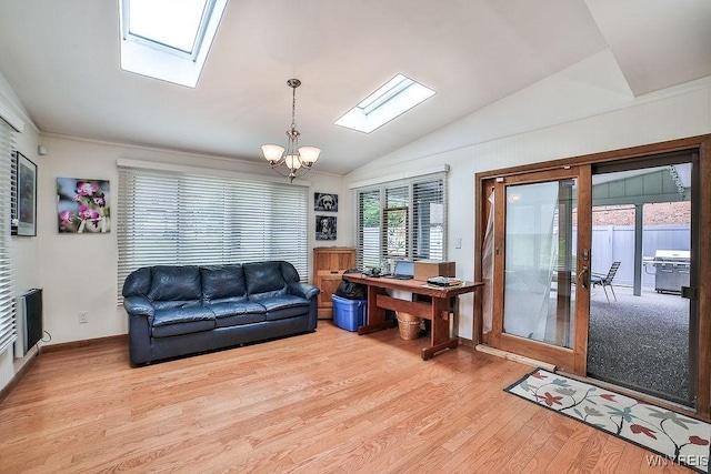 425 Vanderbilt Ave, Niagara Falls, NY 14305 - living room featuring a skylight, light wood-style flooring, a chandelier, and lofted ceiling