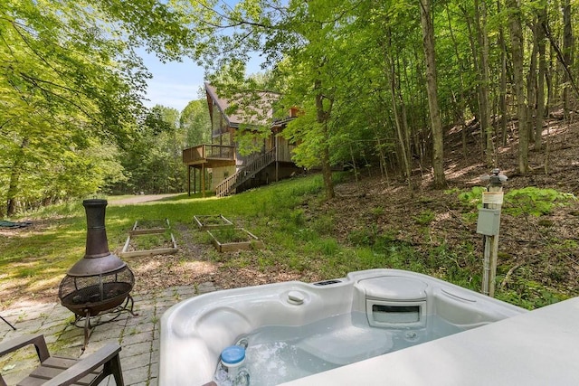 8 Small Rd, Middletown, NY 12455 - view of patio / terrace with a deck, stairs, a fire pit, a hot tub, and a vegetable garden