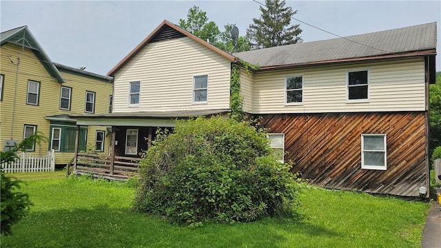 9-11 Bridge St, Sidney, NY 13838 - rear view of property with a lawn