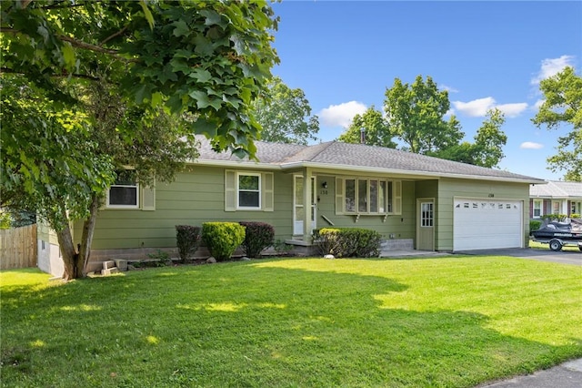 130 Quay Dr, Irondequoit, NY 14617 - single story home featuring a garage, driveway, a front yard, and roof with shingles