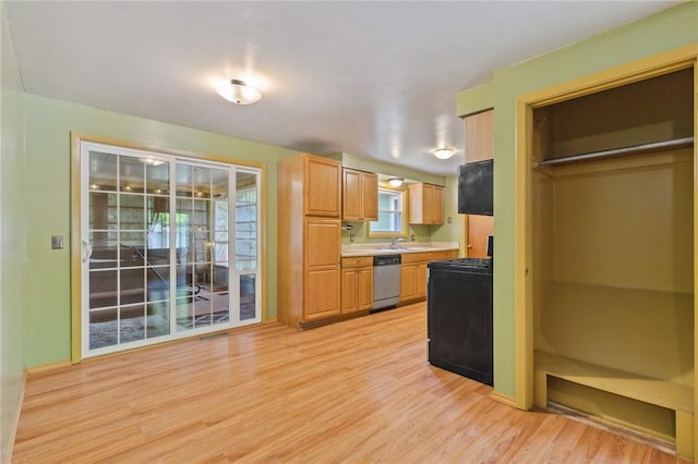 130 Quay Dr, Irondequoit, NY 14617 - kitchen with gas range, light wood-type flooring, dishwasher, and light countertops