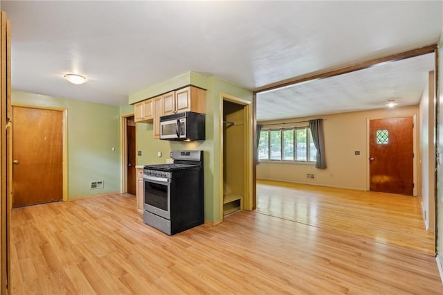 130 Quay Dr, Irondequoit, NY 14617 - kitchen with stainless steel appliances, light wood finished floors, and light brown cabinets