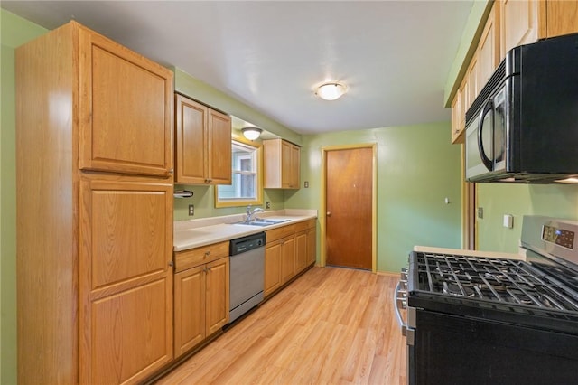 130 Quay Dr, Irondequoit, NY 14617 - kitchen with stainless steel appliances, light wood finished floors, and light countertops