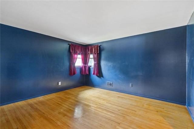 130 Quay Dr, Irondequoit, NY 14617 - empty room featuring wood finished floors and baseboards