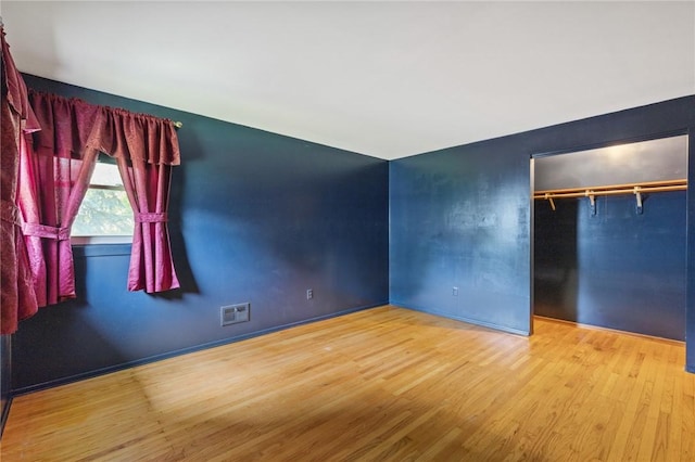 130 Quay Dr, Irondequoit, NY 14617 - unfurnished bedroom with wood finished floors and a closet