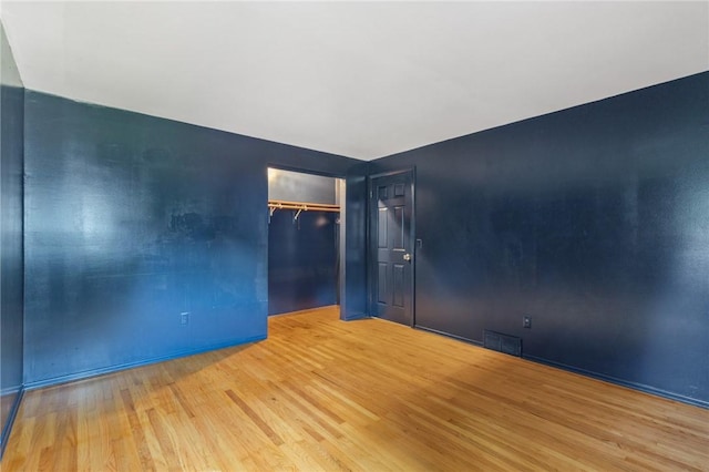 130 Quay Dr, Irondequoit, NY 14617 - unfurnished bedroom with wood finished floors and a closet