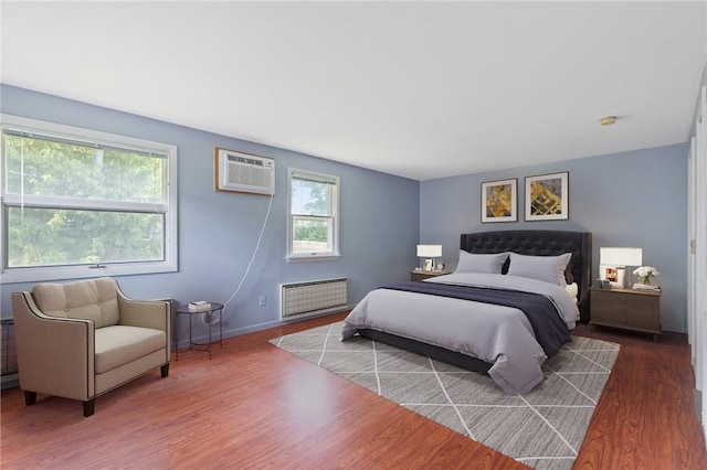 130 Quay Dr, Irondequoit, NY 14617 - bedroom with wood finished floors and a wall mounted AC