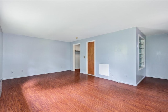 130 Quay Dr, Irondequoit, NY 14617 - spare room featuring wood finished floors and baseboards