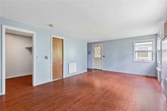 130 Quay Dr, Irondequoit, NY 14617 - unfurnished bedroom with wood finished floors and multiple windows
