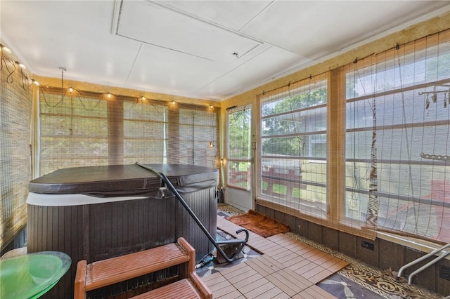 130 Quay Dr, Irondequoit, NY 14617 - sunroom with a jacuzzi and wood walls