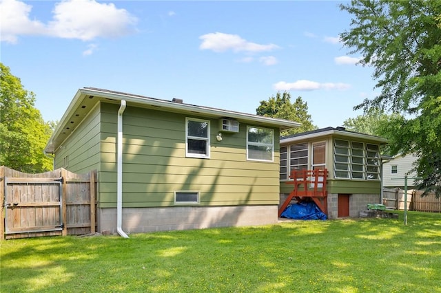 130 Quay Dr, Irondequoit, NY 14617 - rear view of house featuring a sunroom