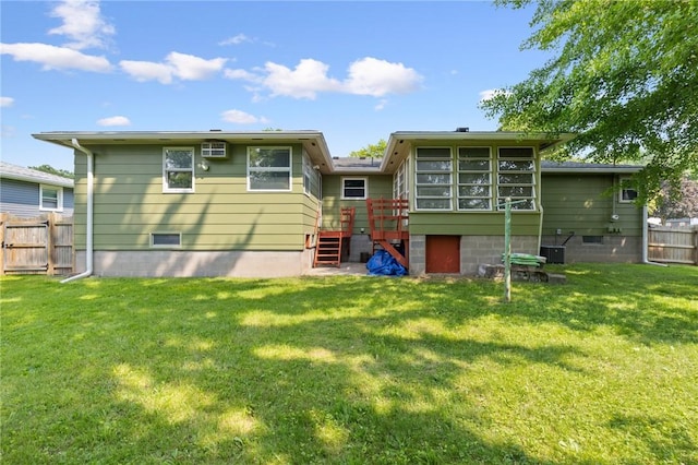 130 Quay Dr, Irondequoit, NY 14617 - back of property with a sunroom, stairs, and a wooden deck