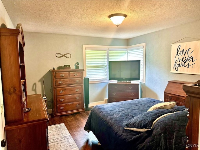 407 Pleasant St, Utica, NY 13501 - bedroom featuring a textured ceiling and dark wood-type flooring
