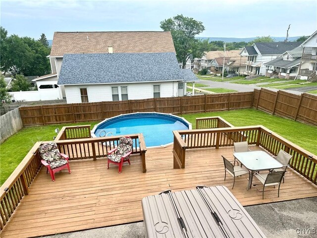 407 Pleasant St, Utica, NY 13501 - wooden terrace with a fenced backyard, outdoor dining area, and a residential view