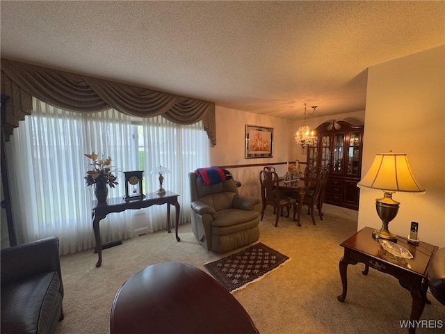66 Fairlane Ave, Tonawanda-Town, NY 14150 - living area with carpet, a chandelier, and a textured ceiling