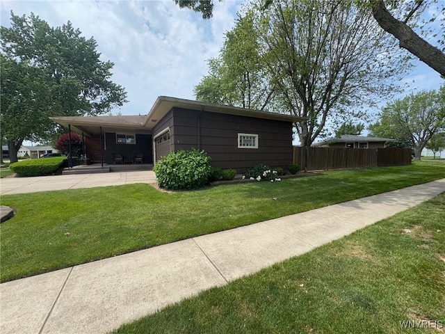 66 Fairlane Ave, Tonawanda-Town, NY 14150 - view of side of home featuring an attached garage and concrete driveway