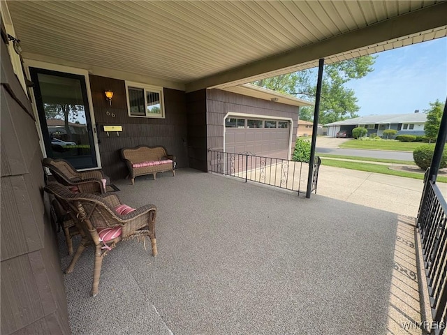 66 Fairlane Ave, Tonawanda-Town, NY 14150 - view of patio / terrace featuring a garage and concrete driveway