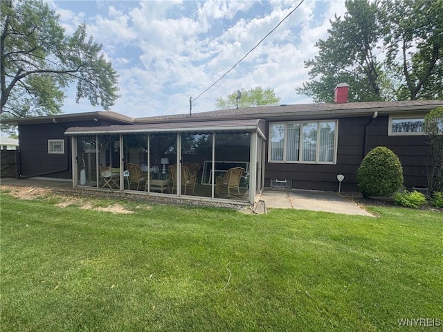 66 Fairlane Ave, Tonawanda-Town, NY 14150 - back of property featuring a patio area, a yard, a sunroom, and a chimney