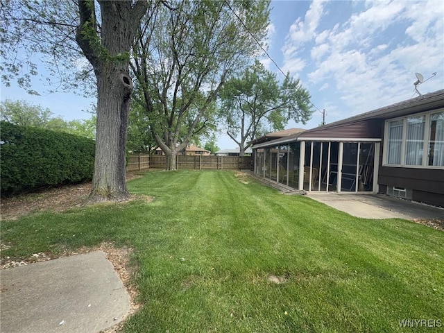 66 Fairlane Ave, Tonawanda-Town, NY 14150 - view of yard featuring a patio area and a sunroom