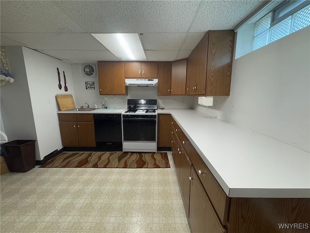 66 Fairlane Ave, Tonawanda-Town, NY 14150 - kitchen featuring white range with gas stovetop, dishwasher, under cabinet range hood, a paneled ceiling, and light countertops