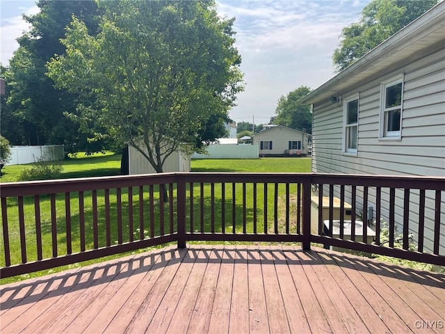 201 Sayles St, Oneida-Inside, NY 13421 - wooden terrace with a storage unit and a lawn