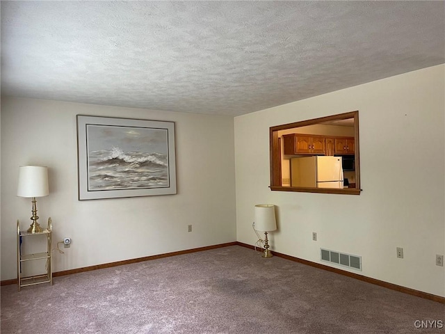 201 Sayles St, Oneida-Inside, NY 13421 - unfurnished room with a textured ceiling and carpet
