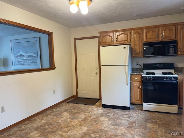 201 Sayles St, Oneida-Inside, NY 13421 - kitchen with black microwave, freestanding refrigerator, range with gas cooktop, stone finish flooring, and a textured ceiling