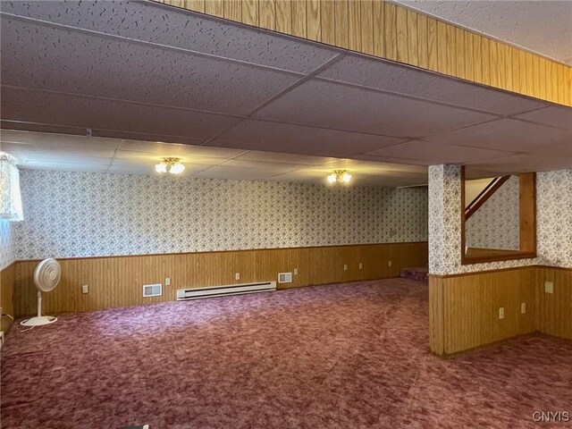201 Sayles St, Oneida-Inside, NY 13421 - finished basement with wallpapered walls, a baseboard radiator, wainscoting, carpet floors, and a drop ceiling