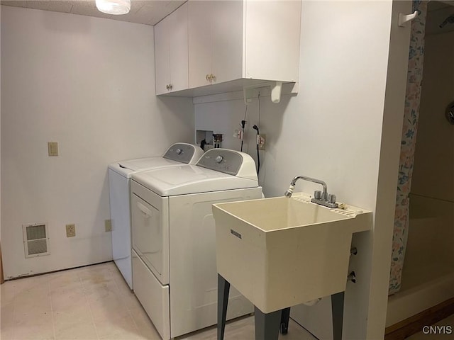 201 Sayles St, Oneida-Inside, NY 13421 - laundry room with cabinet space and independent washer and dryer