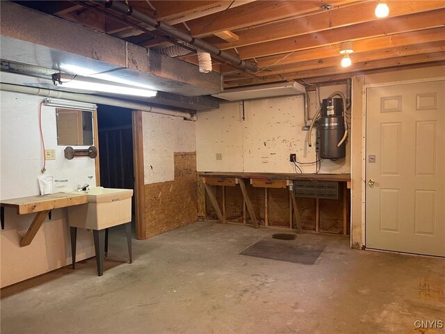201 Sayles St, Oneida-Inside, NY 13421 - unfinished basement with a workshop area and a central vacuum unit