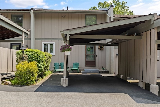 3 Harbour Ln, South Bristol, NY 14424 - doorway to property featuring a chimney and covered parking