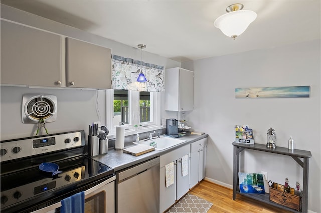 3 Harbour Ln, South Bristol, NY 14424 - kitchen featuring stainless steel appliances, light wood-style floors, and pendant lighting