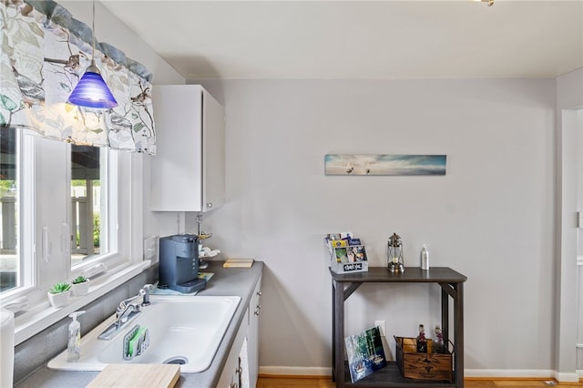 3 Harbour Ln, South Bristol, NY 14424 - kitchen with wood finished floors, white cabinets, and pendant lighting
