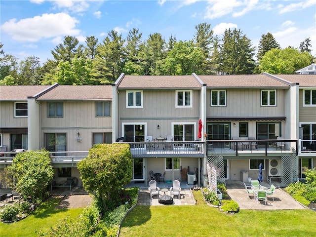3 Harbour Ln, South Bristol, NY 14424 - back of property featuring a patio, an outdoor fire pit, a yard, and roof with shingles
