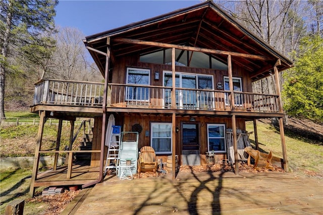 6121 Beechtree Dr, South Bristol, NY 14512 - rear view of house featuring a deck and stairs