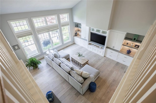 15 Cathedral Oaks, Perinton, NY 14450 - living area with light wood-style flooring and a high ceiling