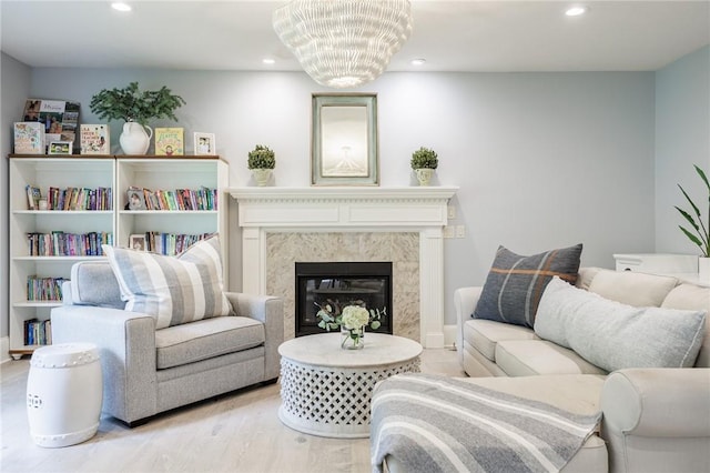 15 Cathedral Oaks, Perinton, NY 14450 - living area featuring recessed lighting, wood finished floors, and a high end fireplace