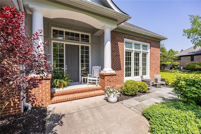 15 Cathedral Oaks, Perinton, NY 14450 - property entrance featuring brick siding and a porch