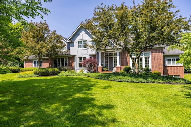 15 Cathedral Oaks, Perinton, NY 14450 - tudor home featuring a front lawn and brick siding