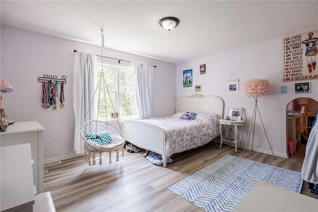 15 Cathedral Oaks, Perinton, NY 14450 - bedroom featuring wood finished floors and arched walkways