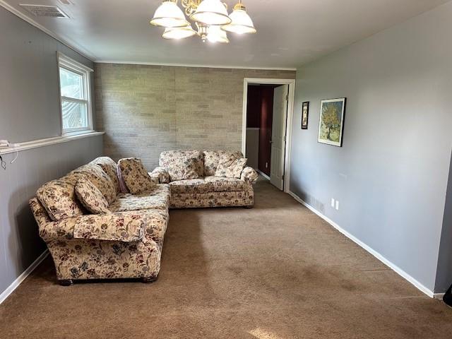 41 Wallman Dr, Henrietta, NY 14467 - carpeted living area featuring a chandelier and baseboards