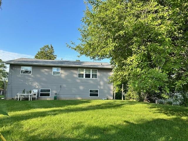 41 Wallman Dr, Henrietta, NY 14467 - rear view of house featuring a yard
