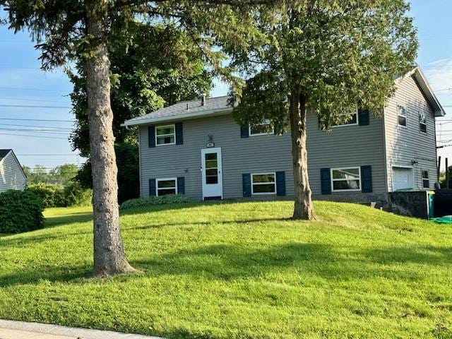 41 Wallman Dr, Henrietta, NY 14467 - view of front of home with a front yard and a garage