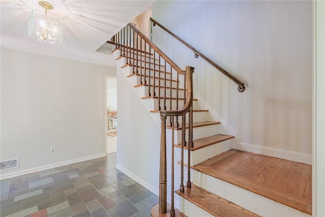 21 Chipping, Perinton, NY 14450 - stairs with stone tile flooring and a chandelier