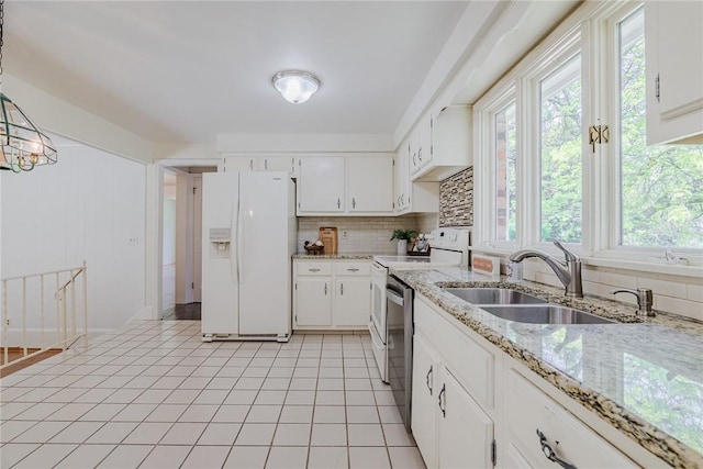 21 Chipping, Perinton, NY 14450 - kitchen featuring white refrigerator with ice dispenser, stove, healthy amount of natural light, and backsplash