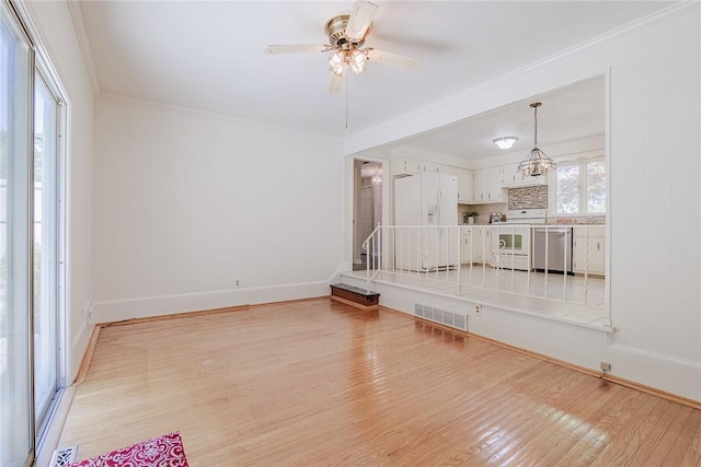 21 Chipping, Perinton, NY 14450 - unfurnished living room featuring light wood-type flooring, ceiling fan, and crown molding