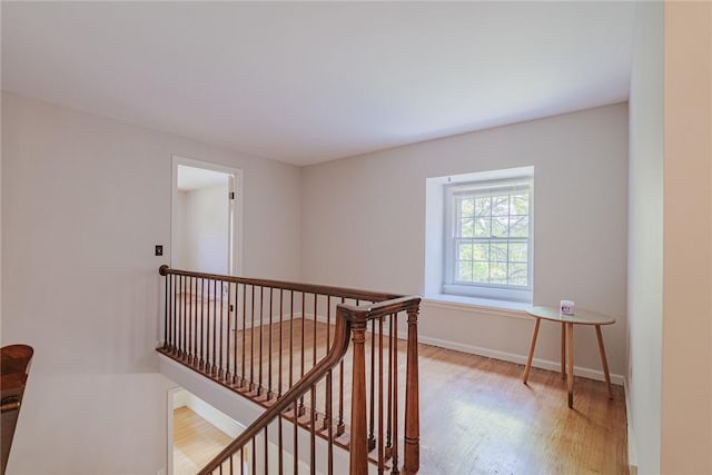 21 Chipping, Perinton, NY 14450 - corridor with an upstairs landing and light wood-style floors